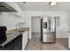 Modern kitchen with stainless steel appliances and granite counters at 7024 Filbert Ln, Tampa, FL 33637