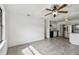 Open-concept kitchen with stainless steel appliances and grey tile floors at 7024 Filbert Ln, Tampa, FL 33637