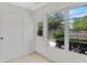 Bright sunroom with backyard access and tile flooring at 1466 Normandy Park Dr # 4, Clearwater, FL 33756