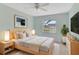 Bright bedroom with a queen bed, light walls, and a large window at 1466 Normandy Park Dr # 4, Clearwater, FL 33756