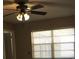 Bedroom with ceiling fan and window coverings at 13806 Capitol Dr, Tampa, FL 33613