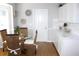 Cozy breakfast nook featuring wicker chairs, a glass table, and built in cabinetry at 13451 Knotty Ln, Hudson, FL 34669