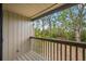 Private balcony overlooking lush green trees and landscape at 758 Pine Run Dr # 758, Osprey, FL 34229