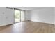 Living room with sliding glass doors to a patio at 758 Pine Run Dr # 758, Osprey, FL 34229