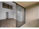 Spacious bedroom with wood-look floors and private balcony access at 758 Pine Run Dr # 758, Osprey, FL 34229