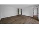 Bright living room with wood-look floors and access to the patio at 758 Pine Run Dr # 758, Osprey, FL 34229