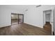 Spacious bedroom with wood-look floors and private balcony at 758 Pine Run Dr # 758, Osprey, FL 34229