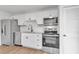 Modern kitchen with white cabinets and stainless steel appliances at 758 Pine Run Dr # 758, Osprey, FL 34229