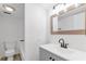 Updated bathroom with gray vanity, black matte fixtures, and tub shower combo at 758 Pine Run Dr # 758, Osprey, FL 34229