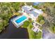 Aerial view of community pool with surrounding patio furniture at 758 Pine Run Dr # 758, Osprey, FL 34229