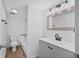 Updated bathroom with gray vanity, black matte fixtures, and a tub shower combo at 758 Pine Run Dr # 758, Osprey, FL 34229