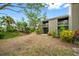 Ground-level patio with surrounding landscape at 758 Pine Run Dr # 758, Osprey, FL 34229