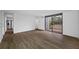Spacious living area featuring wood-look floors and access to patio at 758 Pine Run Dr # 758, Osprey, FL 34229