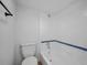 Clean bathroom with white tile, a shower/tub combo, and wood-look floors at 758 Pine Run Dr # 758, Osprey, FL 34229