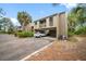 Exterior view of building, showcasing carport and landscaping at 758 Pine Run Dr # 758, Osprey, FL 34229