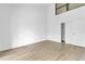 Bright bedroom with high ceiling and wood-look flooring at 758 Pine Run Dr # 758, Osprey, FL 34229