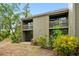 Building exterior with landscaping and private patio access at 758 Pine Run Dr # 758, Osprey, FL 34229