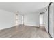 Spacious living area with wood-look floors and sliding glass doors at 758 Pine Run Dr # 758, Osprey, FL 34229