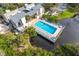 Aerial view of refreshing community pool and surrounding landscape at 758 Pine Run Dr # 758, Osprey, FL 34229