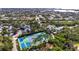 Aerial view of community tennis courts and surrounding neighborhood at 758 Pine Run Dr # 758, Osprey, FL 34229