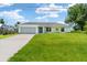 Newly built home with spacious lawn and driveway at 10317 Gulfstream Blvd, Englewood, FL 34224