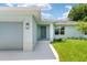 Front view of the house showcasing light gray siding at 10317 Gulfstream Blvd, Englewood, FL 34224