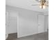 Well-lit bedroom with ceiling fan and walk-in closet at 10317 Gulfstream Blvd, Englewood, FL 34224