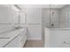 Modern bathroom with double vanity and walk-in shower at 10317 Gulfstream Blvd, Englewood, FL 34224
