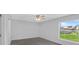 Bright bedroom with large window and ceiling fan at 10317 Gulfstream Blvd, Englewood, FL 34224