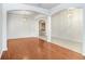 Bright dining room with hardwood floors and elegant chandelier at 3511 Juneberry Dr, Wesley Chapel, FL 33543