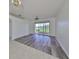 Dining room with wood-look floors and view to screened porch at 633 Tremont Greens Ln # 16, Sun City Center, FL 33573