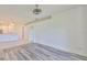 Open concept dining area with gray flooring and kitchen view at 633 Tremont Greens Ln # 16, Sun City Center, FL 33573
