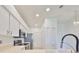 Modern kitchen featuring stainless steel appliances at 633 Tremont Greens Ln # 16, Sun City Center, FL 33573