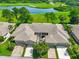 Bird's-eye view of villa with golf course and lake views at 633 Tremont Greens Ln # 16, Sun City Center, FL 33573