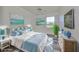 Main bedroom with virtually staged furniture and golf course view at 633 Tremont Greens Ln # 16, Sun City Center, FL 33573