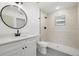 Clean bathroom, featuring white vanity, black fixtures, and a shower/tub combo at 7422 S 34Th Ave, Tampa, FL 33619