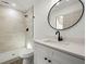 Recently remodeled bathroom with modern cabinets, granite counters, and sleek hardware at 7422 S 34Th Ave, Tampa, FL 33619