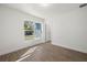 Bright bedroom with wood-look floors and large window at 7422 S 34Th Ave, Tampa, FL 33619