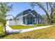 Stylish two-story home with a well-manicured lawn and privacy fence at 7422 S 34Th Ave, Tampa, FL 33619