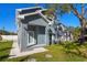 Gray two-story house with a walkway and nicely manicured lawn at 7422 S 34Th Ave, Tampa, FL 33619