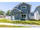 Lovely two-story home with covered porch, manicured lawn and white picket fence at 7422 S 34Th Ave, Tampa, FL 33619
