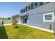 Newly built two-story home features a fenced yard, mature trees and freshly poured patio at 7422 S 34Th Ave, Tampa, FL 33619