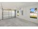 Spacious two car garage with ample natural light and concrete flooring ready to be customized to your needs at 7422 S 34Th Ave, Tampa, FL 33619