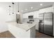 Modern kitchen featuring stainless steel appliances and white cabinetry at 7422 S 34Th Ave, Tampa, FL 33619