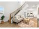 Inviting living room with an open staircase and view of the dining area at 7422 S 34Th Ave, Tampa, FL 33619