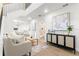 Bright living room featuring wood floors, modern decor, and open staircase at 7422 S 34Th Ave, Tampa, FL 33619