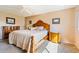 Main bedroom with wood furniture and ceiling fan at 2285 Israeli Dr # 29, Clearwater, FL 33763