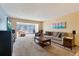 Spacious living room with large windows and neutral carpeting at 2285 Israeli Dr # 29, Clearwater, FL 33763