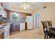 Updated kitchen with wood cabinets, tile backsplash, and tile floor at 2285 Israeli Dr # 29, Clearwater, FL 33763