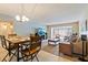 Dining area with wood table and chairs, opens to living room at 2285 Israeli Dr # 29, Clearwater, FL 33763